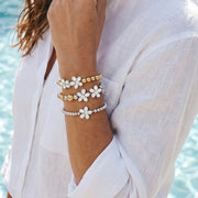 Love Lisa stacked crystal flower bracelets on wrist pave floral beaded bracelet stack styling