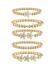 Elegant gold floral bracelet stack with crystal petal flowers