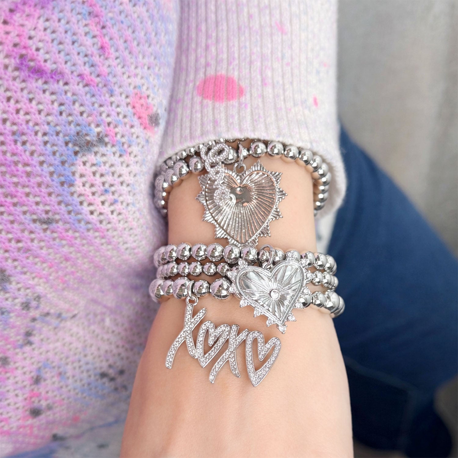 francesca xoxo heart charm bracelet stack silver worn on wrist love lisa jewelry for valentine's day 