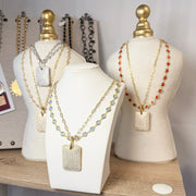 three displays with gabby diamond by the yard necklaces