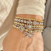 Gina Ribbon Bow Stack of Bracelets Love Lisa worn on wrist
