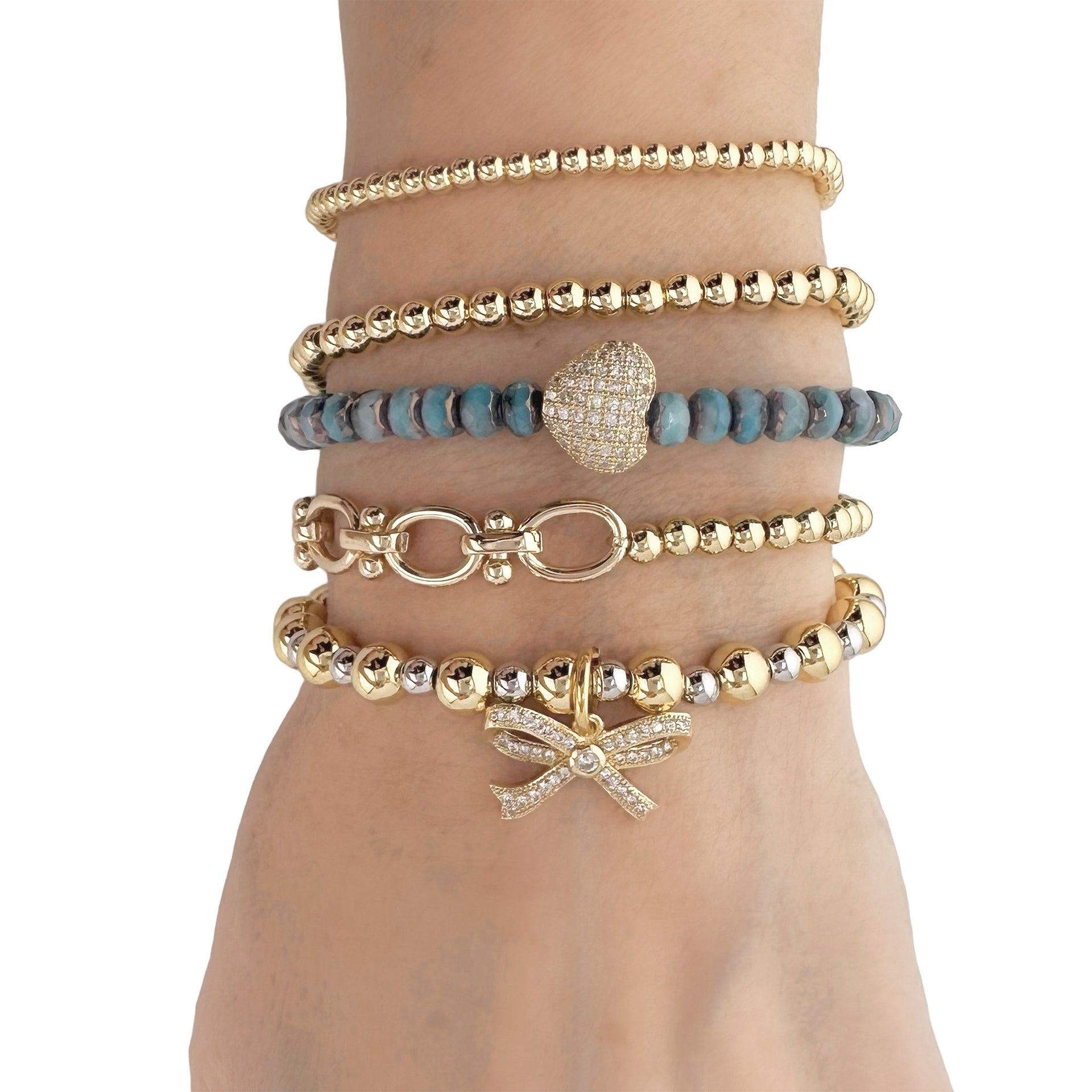 love lisa bow charm bracelets stacked with beaded bangles layered gold and silver jewelry for women