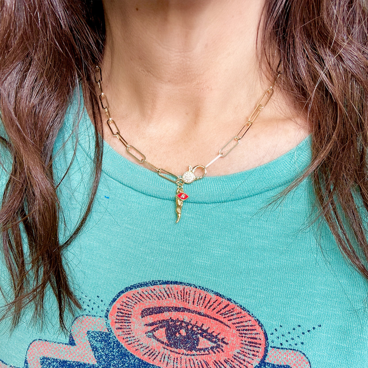 model wearing gold italian horn cornicello necklace with red evil eye charm love lisa italian jewelry gift for her