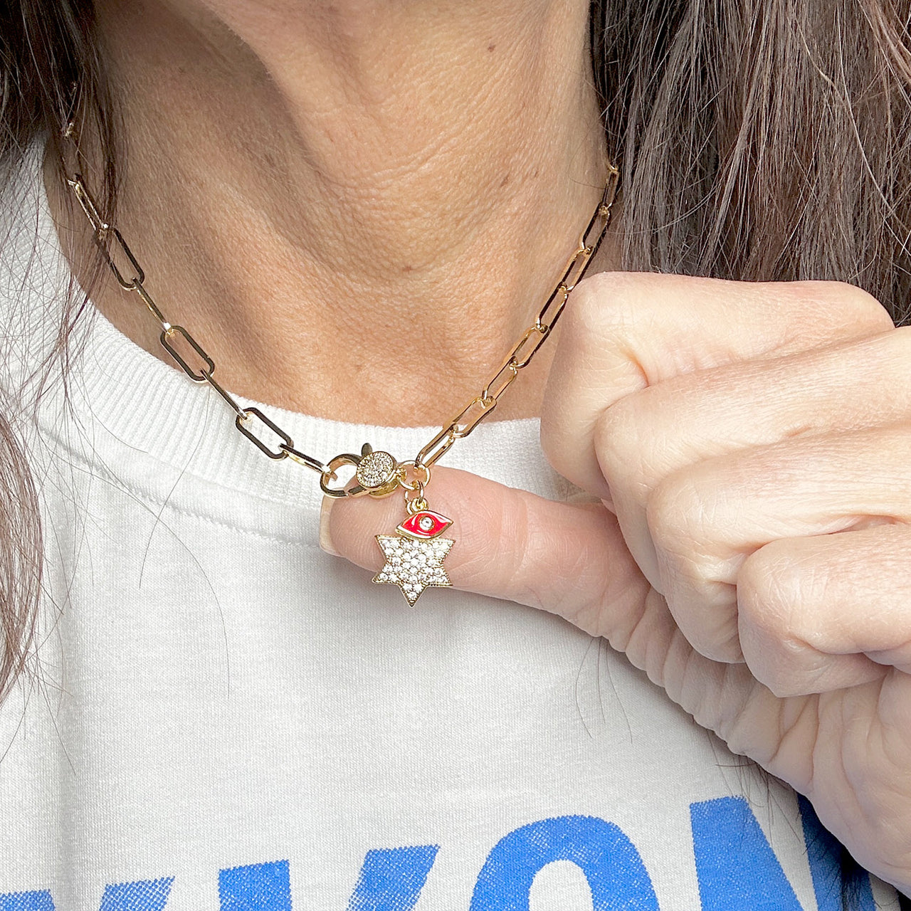 model wearing gold star of david and red evil eye necklace love lisa faith and protection jewelry
