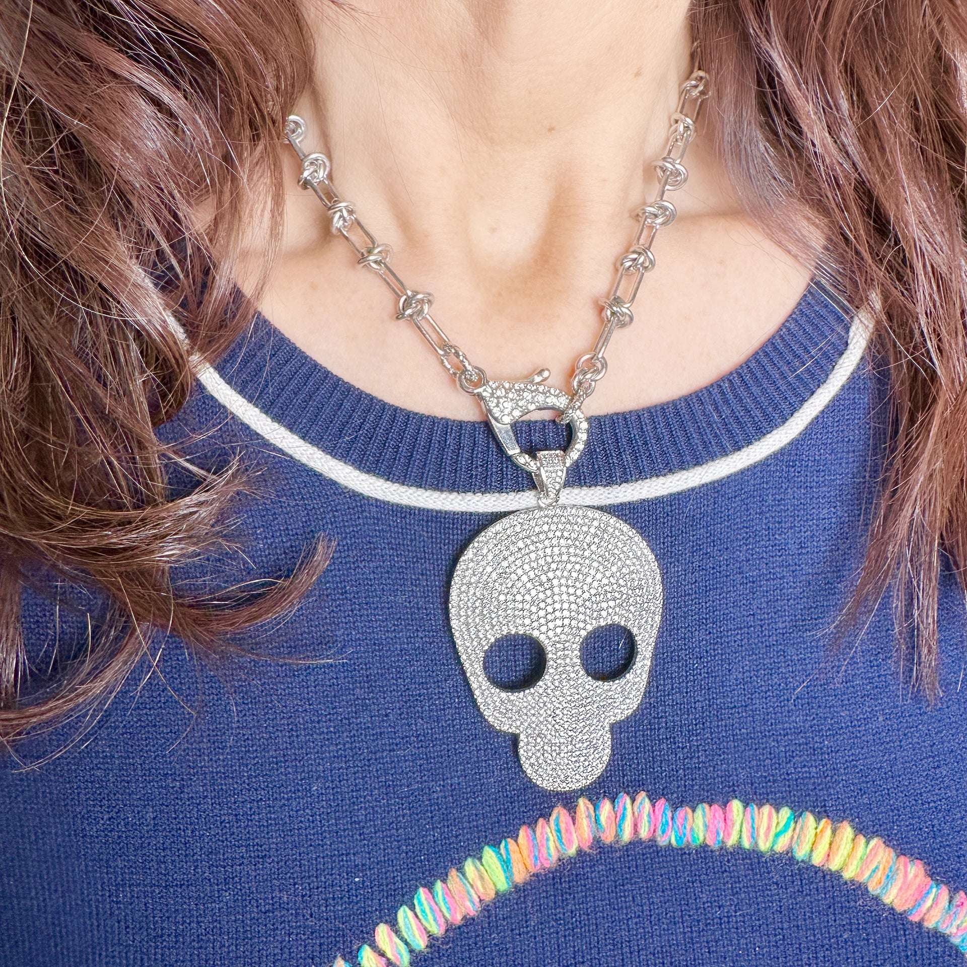 model wearing love lisa glamorous pave skull charm necklace crystal skull pendant jewelry for edgy elegant style