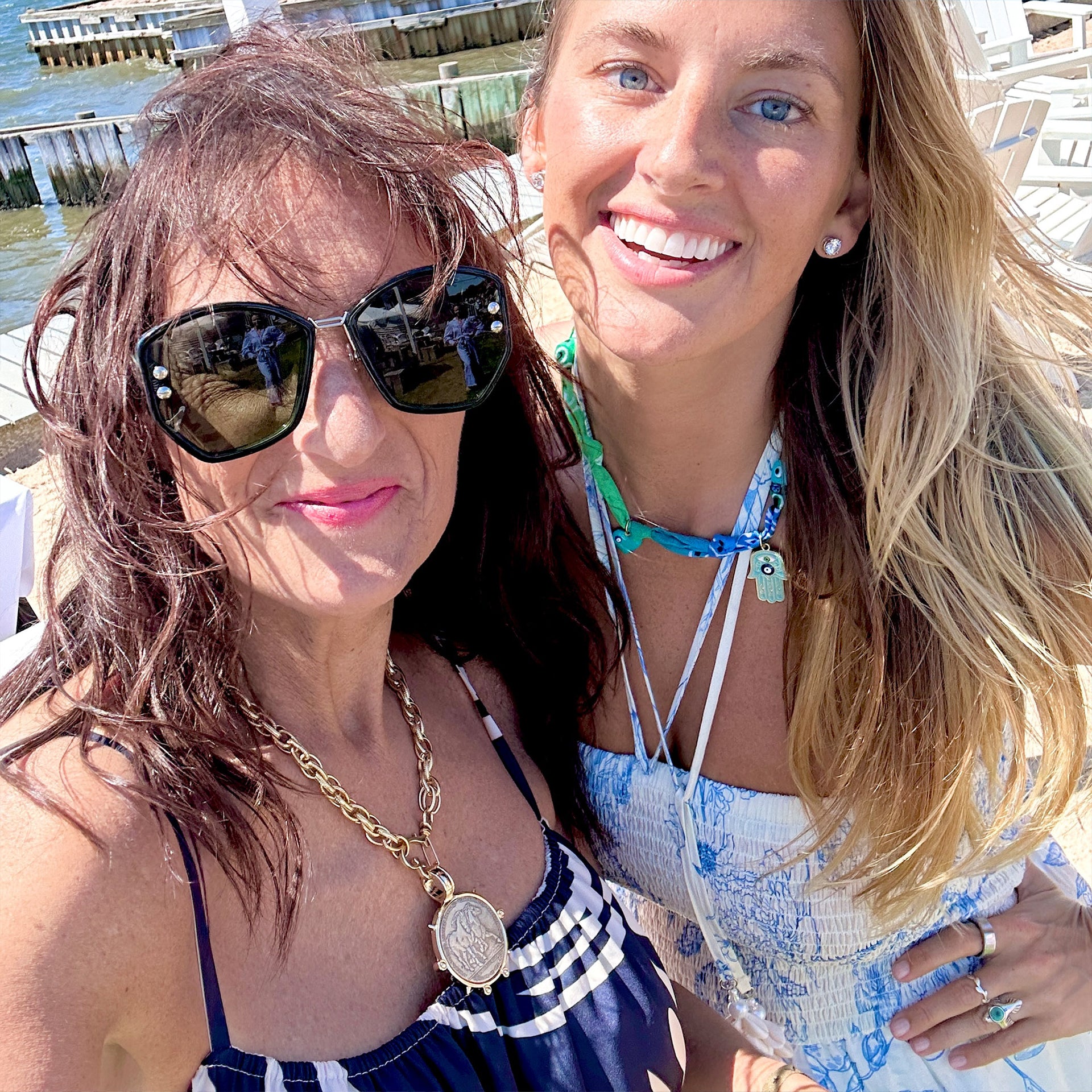 
Gold equestrian coin medallion necklace styled on model outdoors