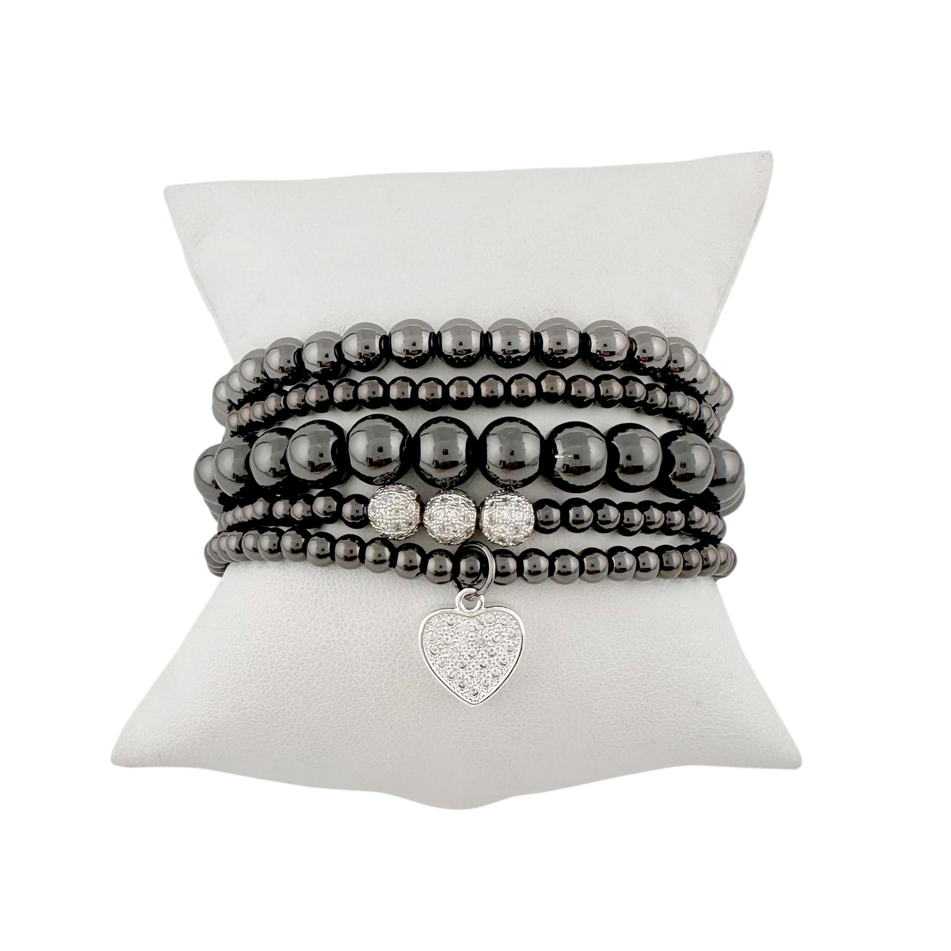 Goldie stack of gunmetal beaded bracelets and a heart charm