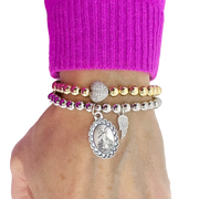 woman wearing gold guardian angel wing beaded bracelet inspirational jewelry