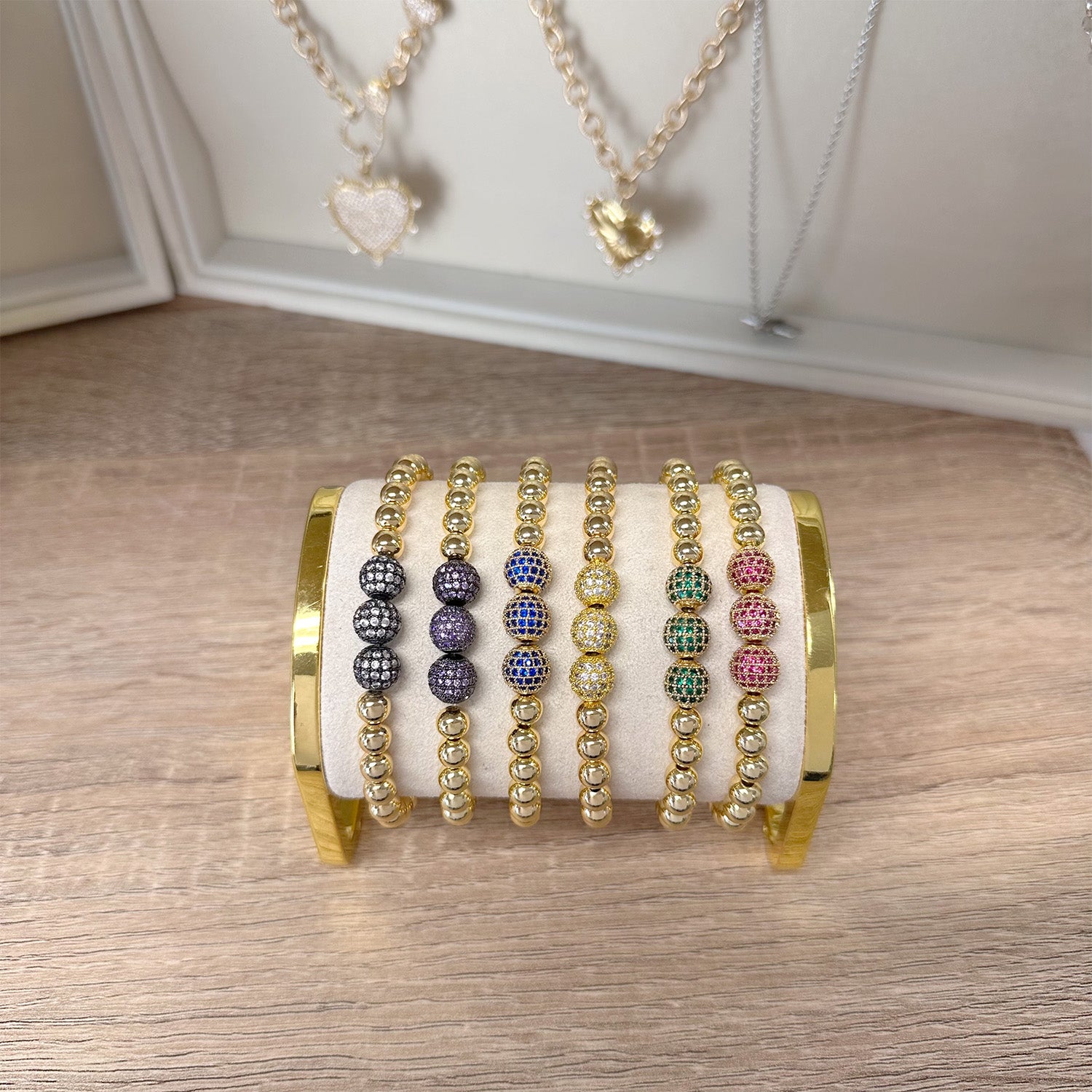 display of gold gwen triple pave beaded bracelets in assorted colors