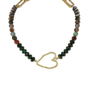 Necklace with beaded chain and gold heart clasp on a white background