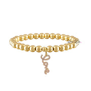 gold beaded bracelet with gold love charm elegant beaded jewelry