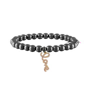 black beaded bracelet with gold love charm modern statement jewelry