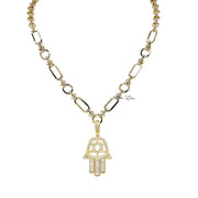 A two-tone gold and silver hamsa necklace with star of david on a bold chain