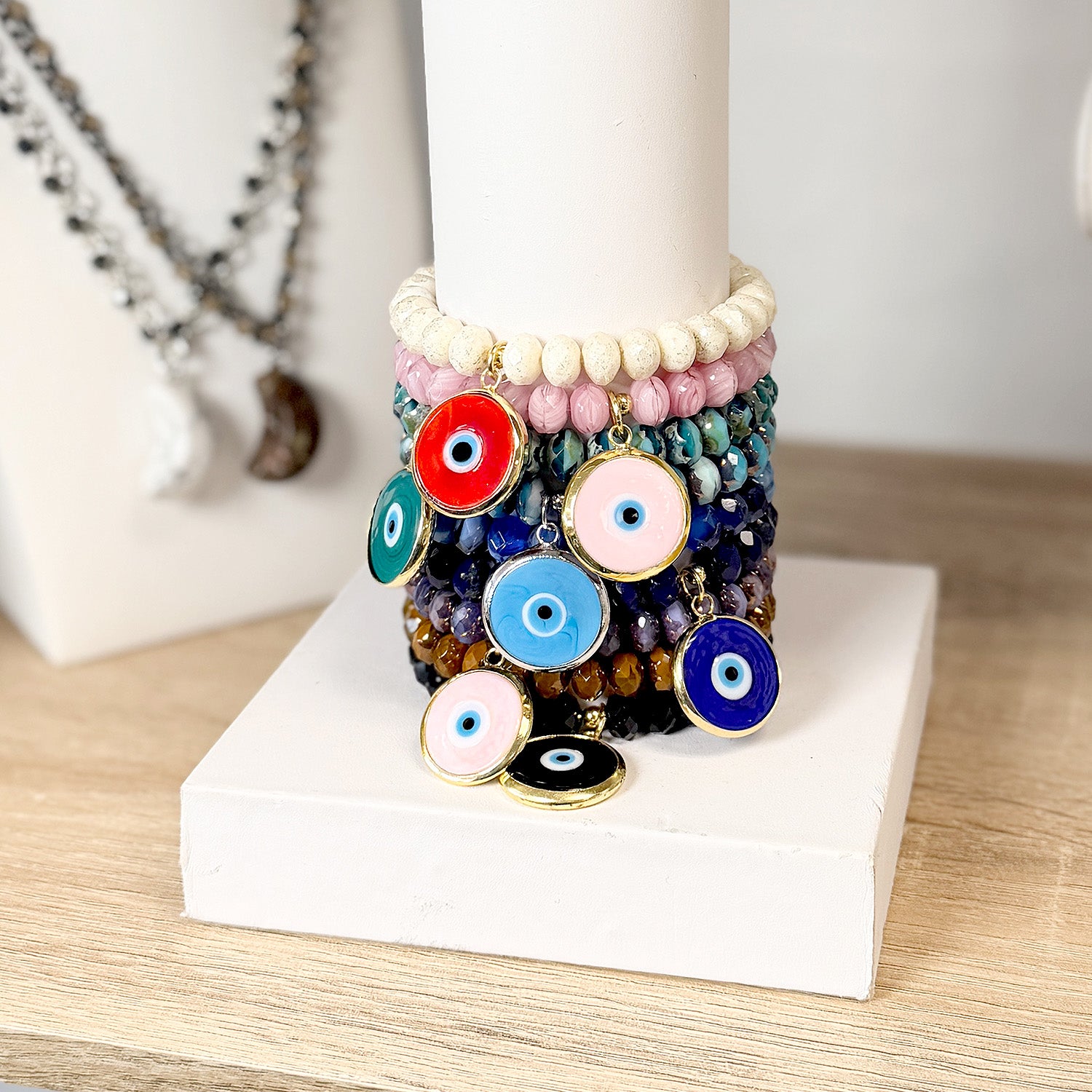 Stacked Murano glass evil eye bracelets in mixed colors