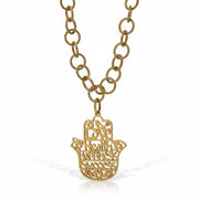 close up of hamsa pendant necklace engraved love health happiness success gold jewelry Love Lisa