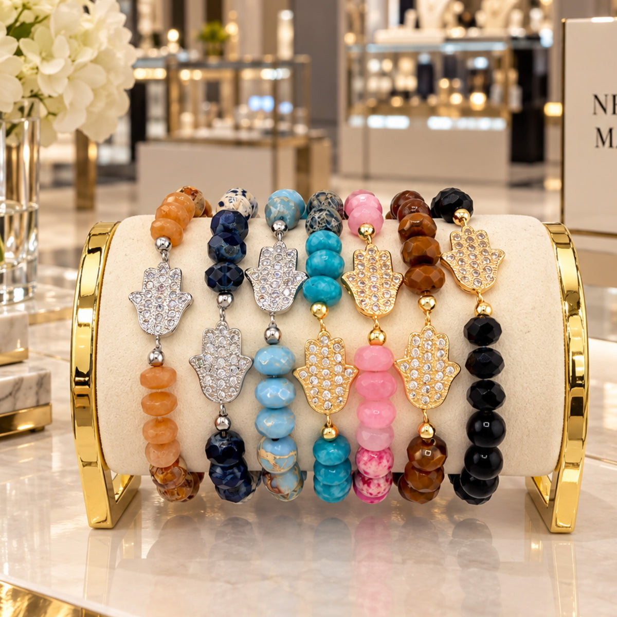 Love Lisa Hamsa Mixed Gemstone Beaded Bracelets displayed together in Beige, Navy, Light Blue, Turquoise, Pink, Brown, and Black with gold-tone and silver-tone pavé Hamsa centerpieces