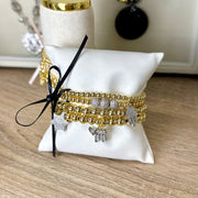 hanukkah judaica charm bracelet stack gold beaded bracelets displayed with chai hamsa and star of david charms