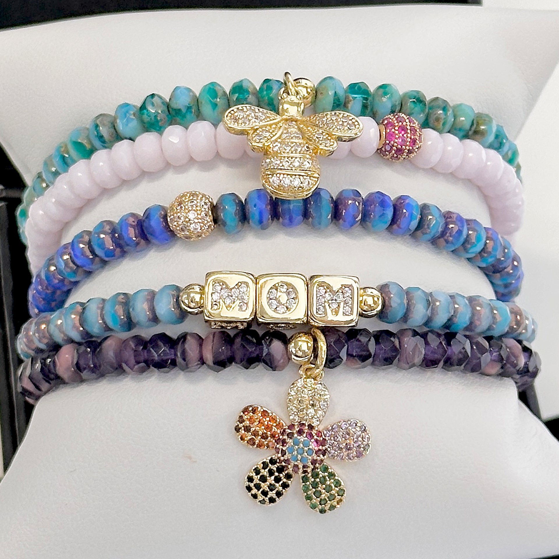  harper mom bracelet stack with rainbow flower charm and bee charm love lisa