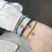layered star of david bracelets on wrist harper colorful jewelry Love Lisa