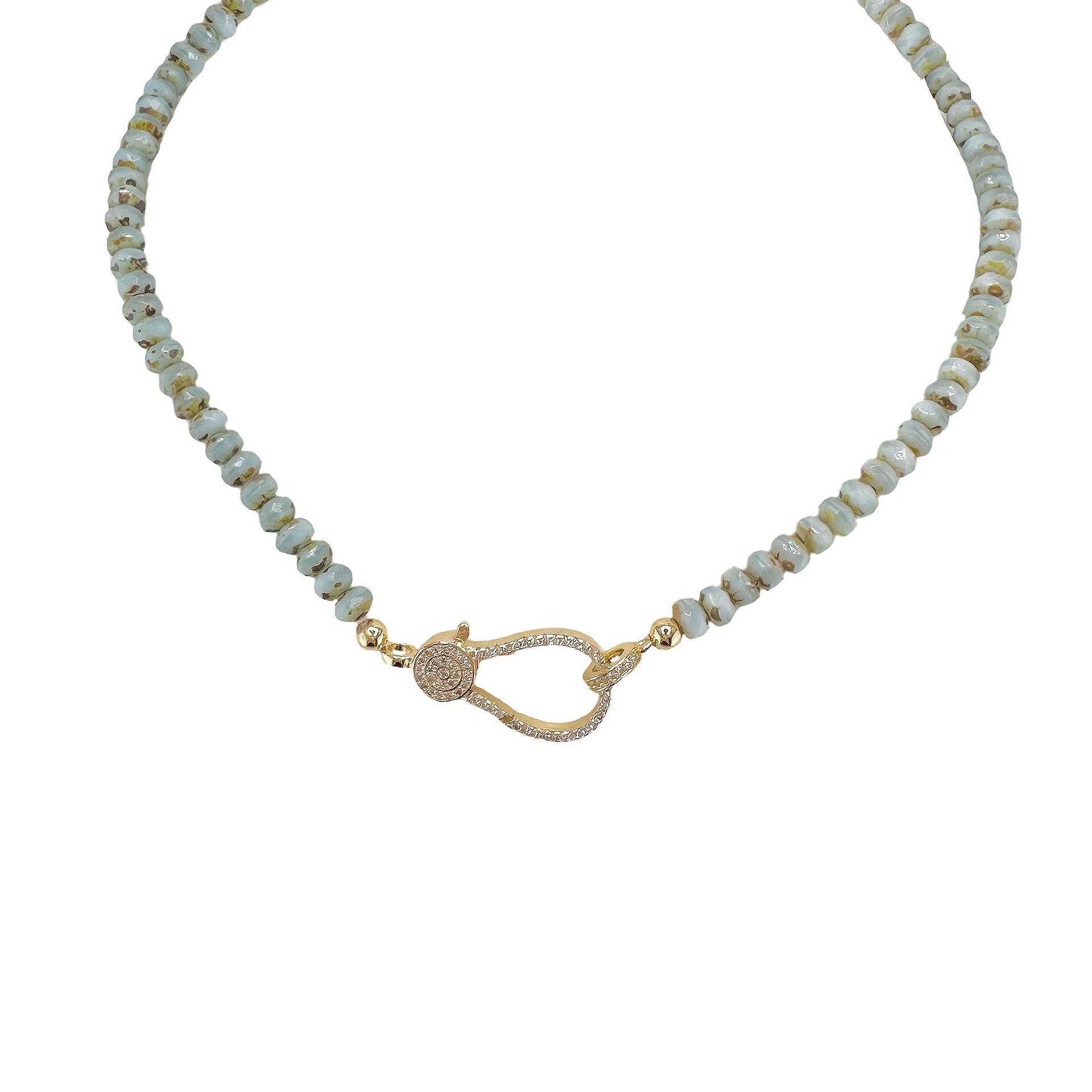 A light blue beaded necklace with a gold pave clasp.