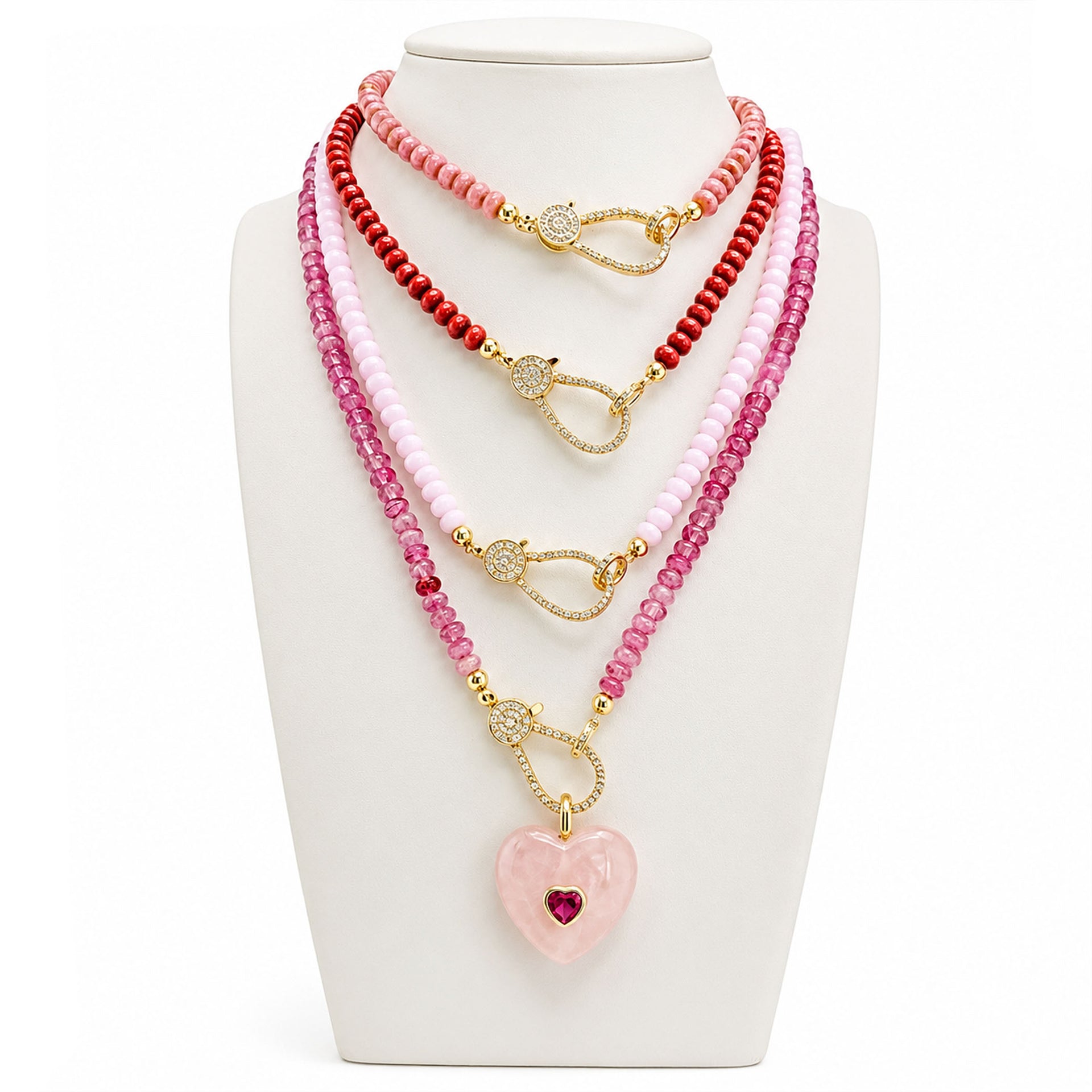 Love Lisa Harper Crystal Clasp Necklaces layered on display in pink and red crystal bead colors with gold easy open clasps and heart charm styling