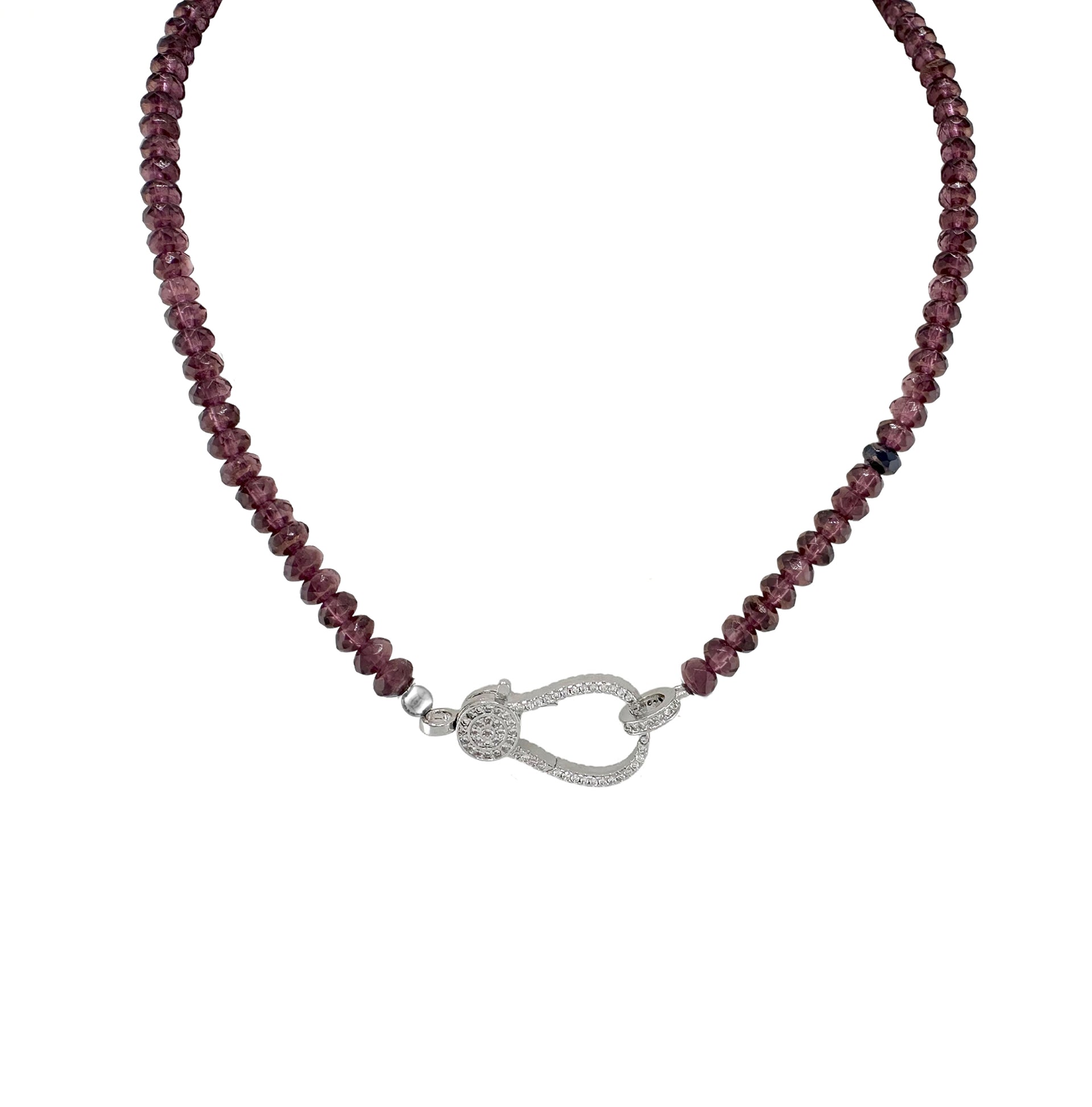A plum beaded necklace with a gold pave clasp.