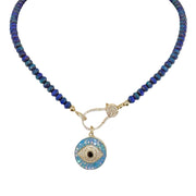 A blue beaded necklace with a gold pave clasp.