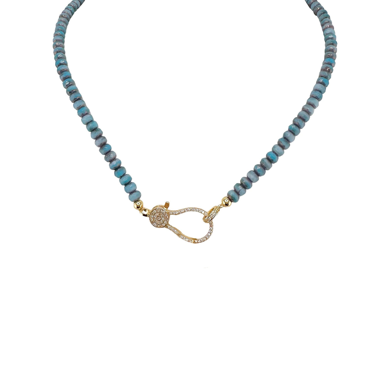 A blue beaded necklace with a gold pave clasp.