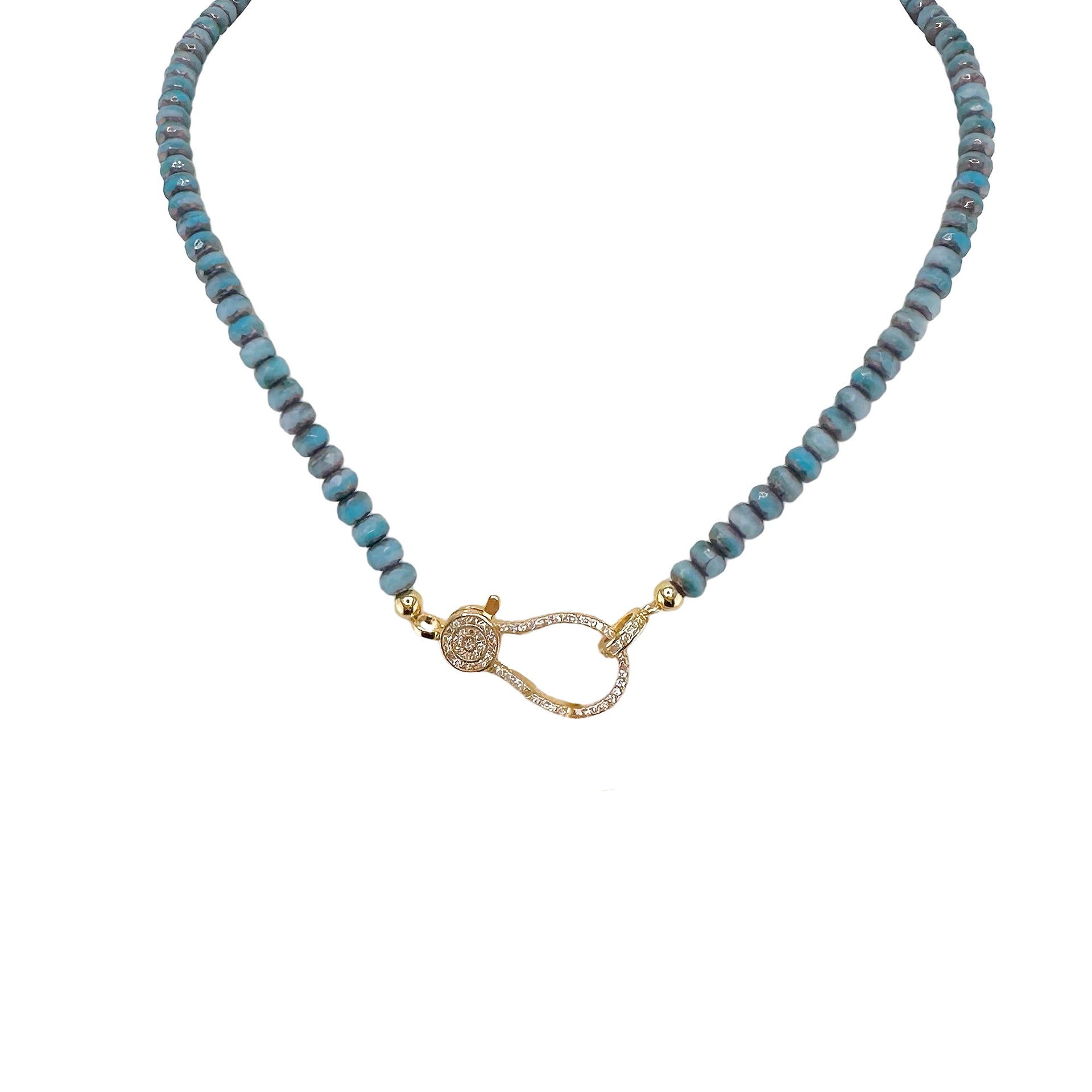 A blue beaded necklace with a gold pave clasp.