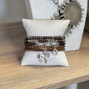 harper equestrian bracelet stack with horse and horseshoe charms on jewelry display Love Lisa