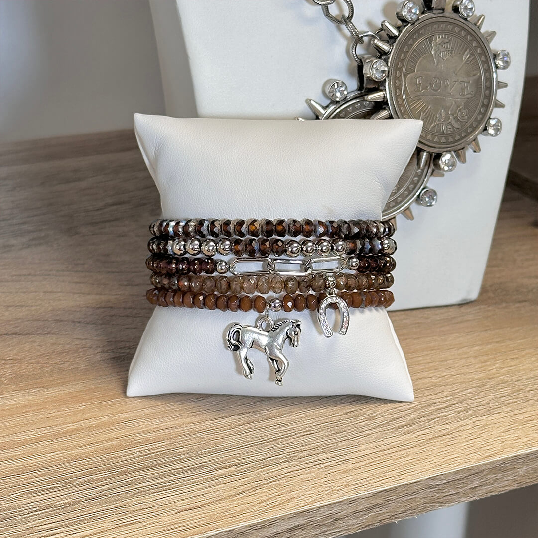 harper equestrian bracelet stack with horse and horseshoe charms on jewelry display Love Lisa