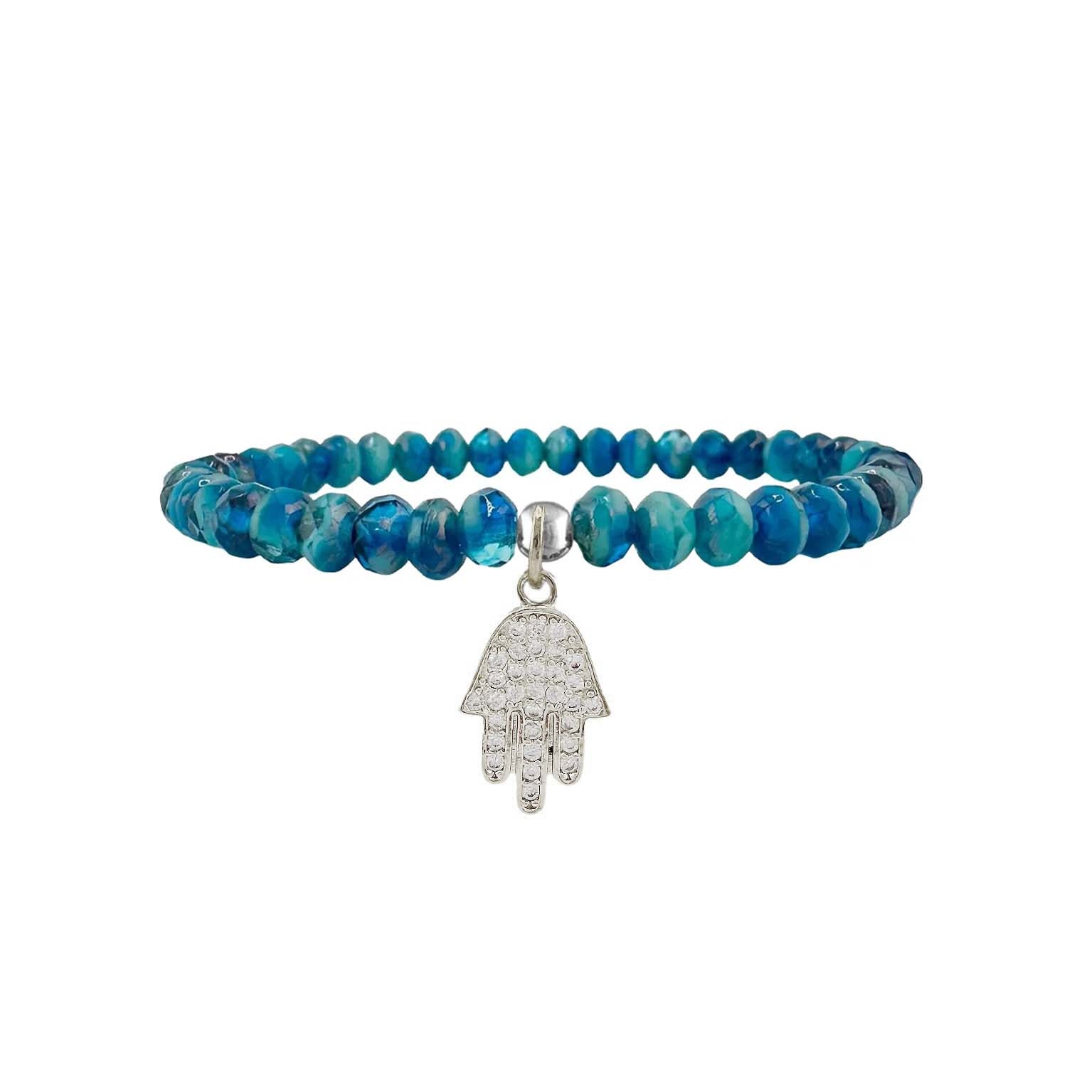 Blue beaded bracelet with a silver Hamsa hand charm on a white background