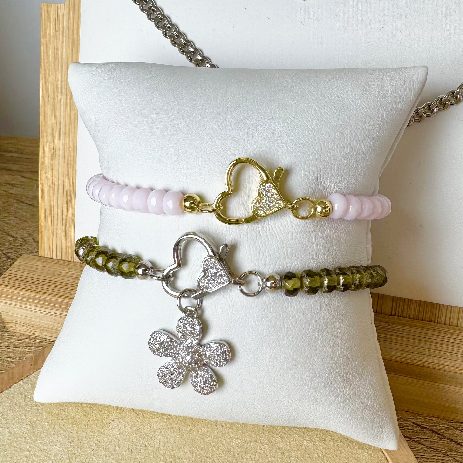 harper heart clasp bracelets displayed on pillow love lisa