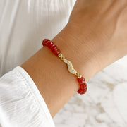 Love Lisa Harper Italian Horn Beaded Bracelet worn on wrist with red crystal beads and set-in Italian horn design