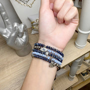 harper love your family bracelet stack layered on wrist with charms Love Lisa