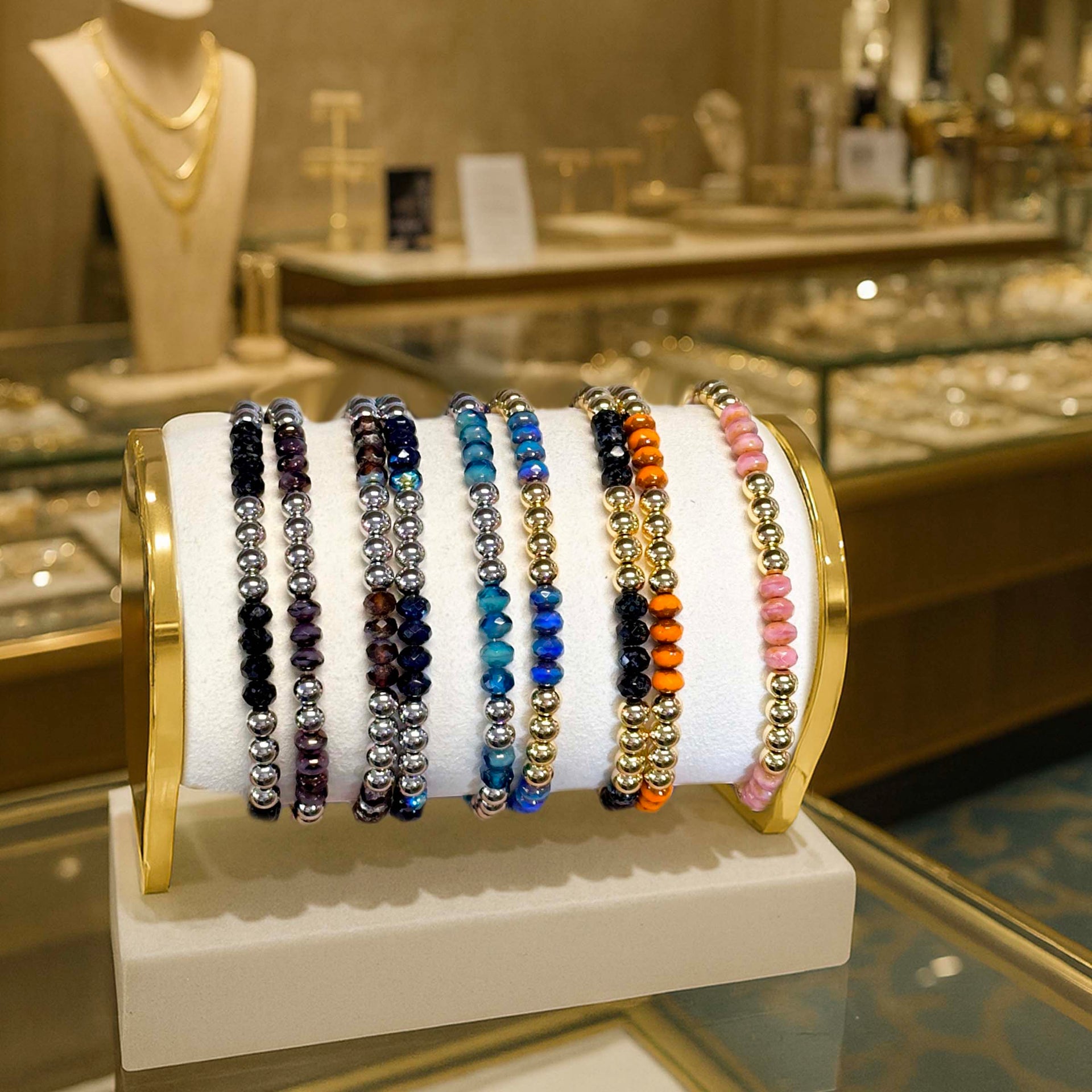Elegant Harper Luxe bracelets on a display case 
