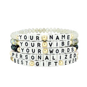 flat lay of harper personalized word bracelets showing custom name and word options with czech crystal beads and letter beads