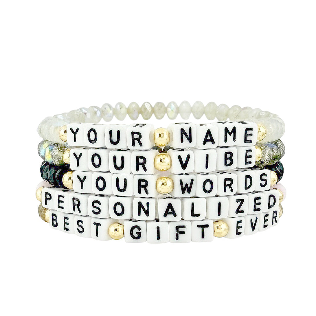 flat lay of harper personalized word bracelets showing custom name and word options with czech crystal beads and letter beads