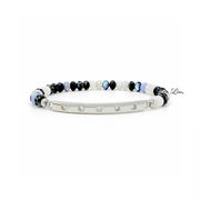 Bracelet with black, white, and blue czech rondelle beads with a silver rhinestone bar on a white background