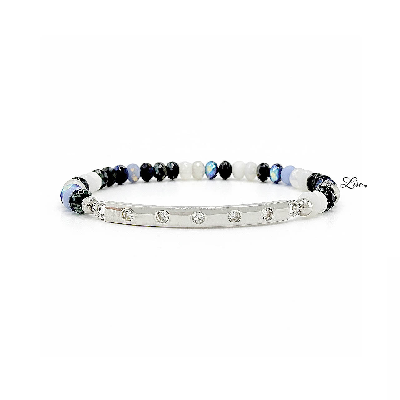Bracelet with black, white, and blue czech rondelle beads with a silver rhinestone bar on a white background