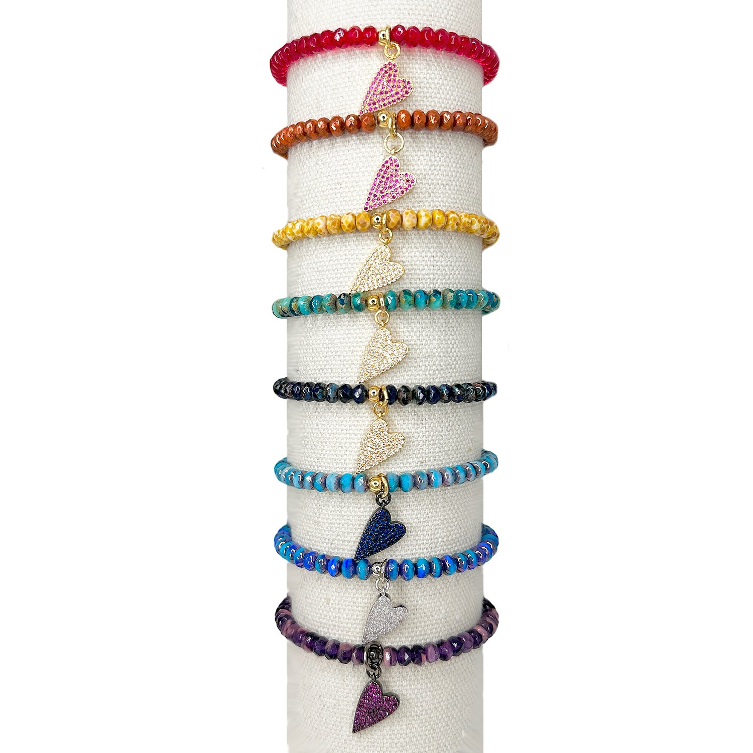 set of harper slanted heart beaded bracelets displayed on jewelry roll showing multiple color variants by Love Lisa