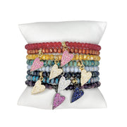 pillow stack of colorful harper slanted heart beaded bracelets showing assorted crystal bead colors and pavé heart charms by Love Lisa
