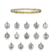 Bracelet with beaded design and various religious medallions on a white background