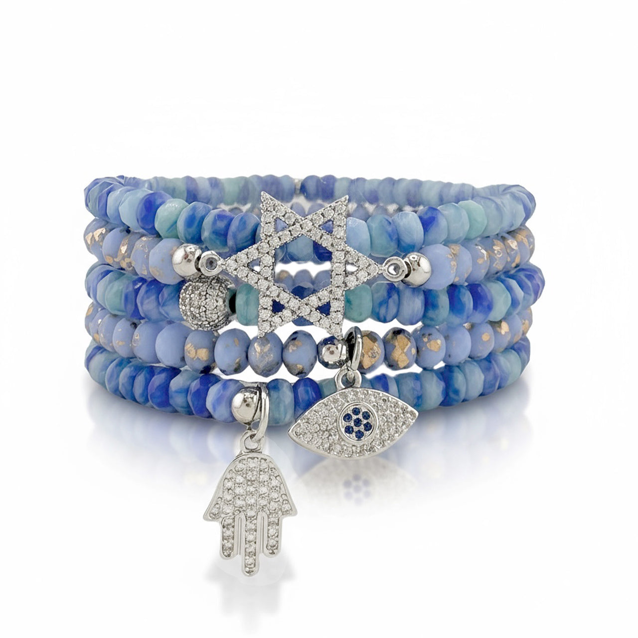 Close-up a stack of the Harper bracelets featuring a crystal Star of David charm, evil eye and hamsa on blue czech beads.