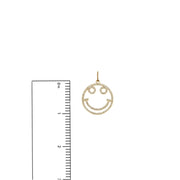 Gold smiley charm shown with ruler – 1 inch size guide