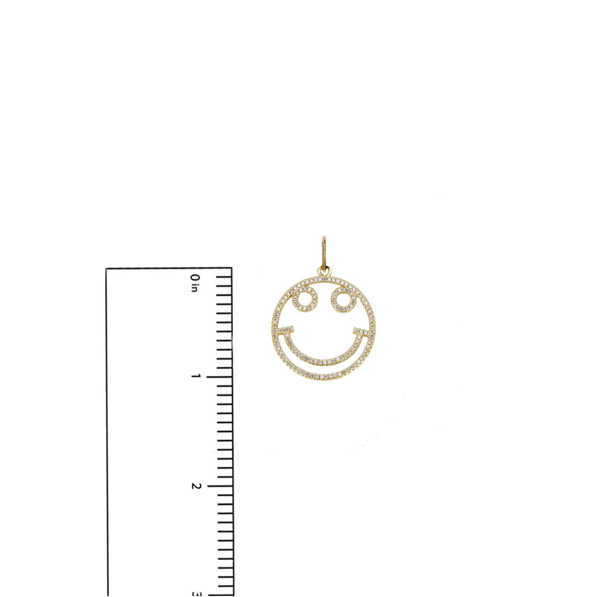 Gold smiley charm shown with ruler – 1 inch size guide