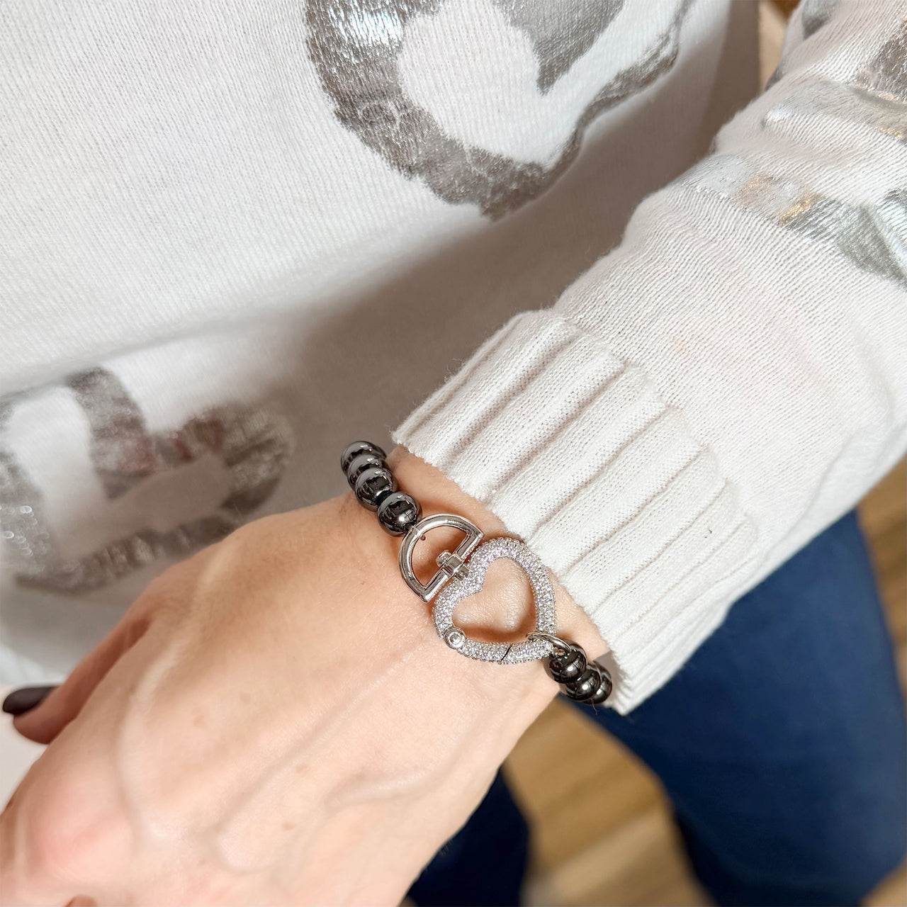 Love Lisa heart clasp stretch bracelet worn on wrist pavé crystal heart charm jewelry styling