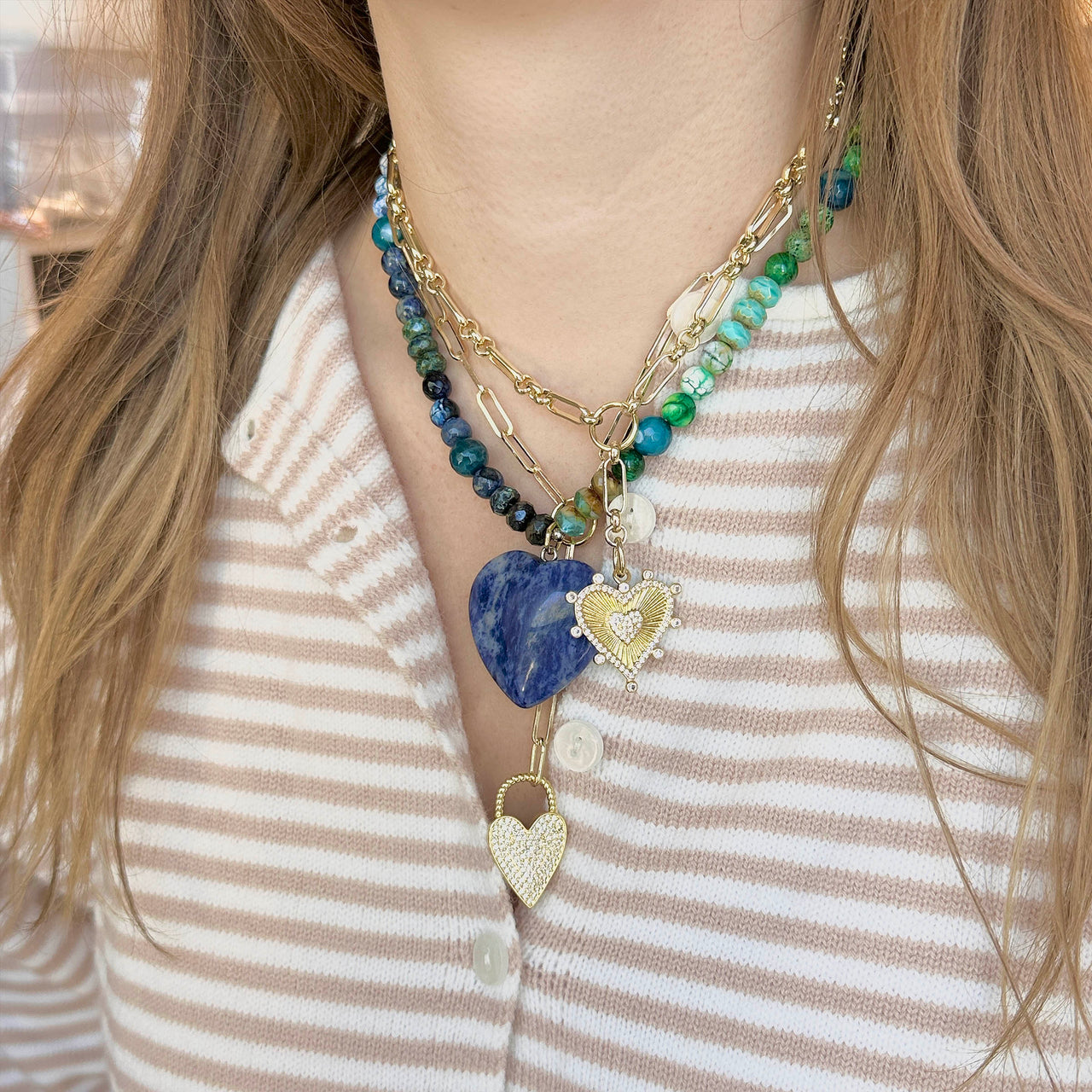 Lifestyle image of Love Lisa Heart Worry Stone Necklace styled with natural gemstone beads and heart pendant for everyday comfort