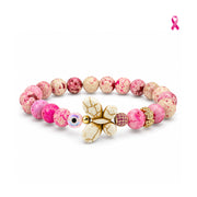 Love Lisa Hope Wish & Wonder Breast Cancer Awareness Butterfly Bracelet with pink Sea Sediment Jasper beads, white howlite butterfly, pink evil eye bead, pavé crystal bead, and crystal flower accent bead