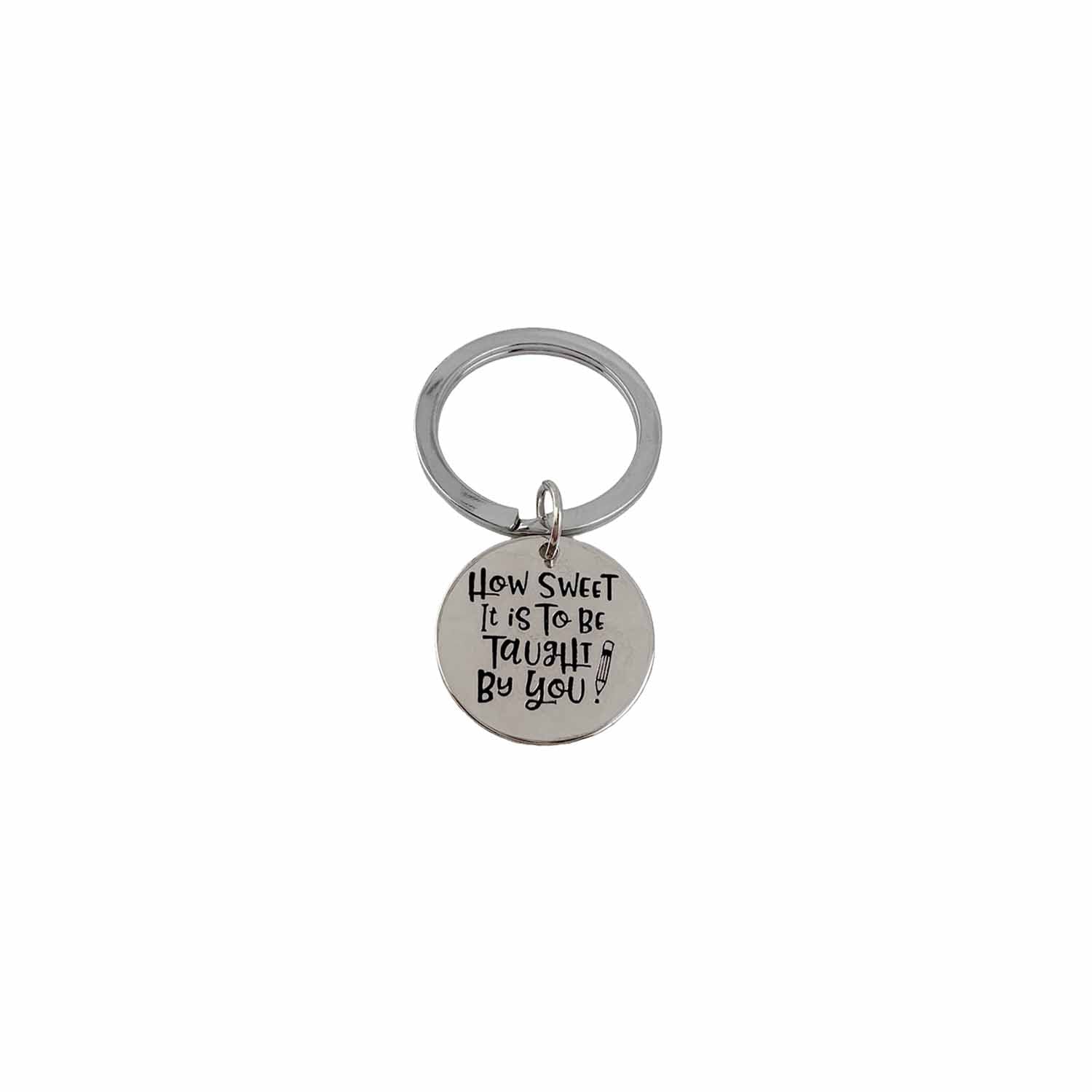 close up of engraved teacher keychain reading how sweet it is to be taught by you by Love Lisa